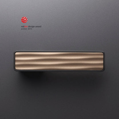 M&T Maximal door lever in black titanium finish (Tin-K) with a custom design insert. Winner of REDDOT Design Award in 2013.