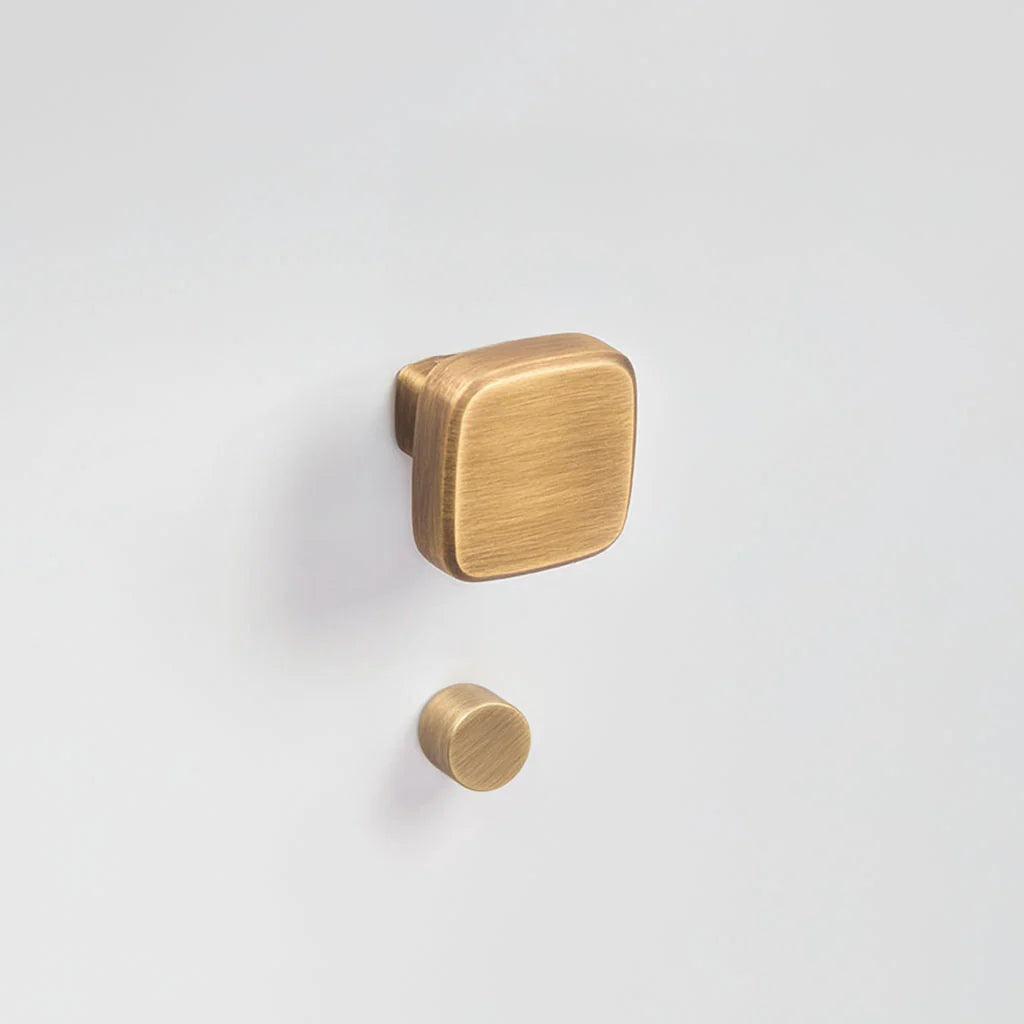 Contemporary Italian square brushed bronze (gold-like) door knob for interior doors with privacy locking - Product name: Verum Cham Yester Bronze with a matching Verum Punto thumb turn. Made by VERUM ITALY.