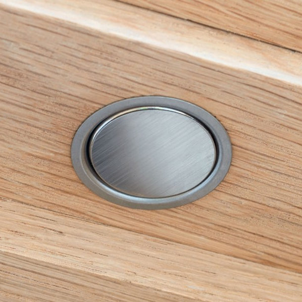 Image showing Verum Stoppino Close, a recessed magnetic catch installed in a white oak wood veneer interior door, in satin stainless steel finish. Made by Verum Italy.