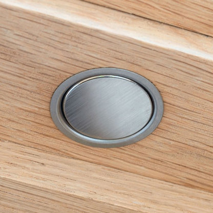 Image showing Verum Stoppino Close, a recessed magnetic catch installed in a white oak wood veneer interior door, in satin stainless steel finish. Made by Verum Italy.